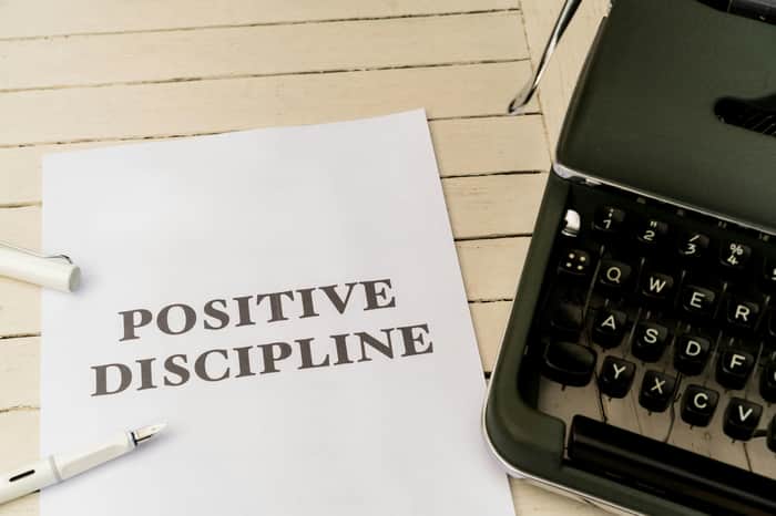 Paper with the word discipline written on it